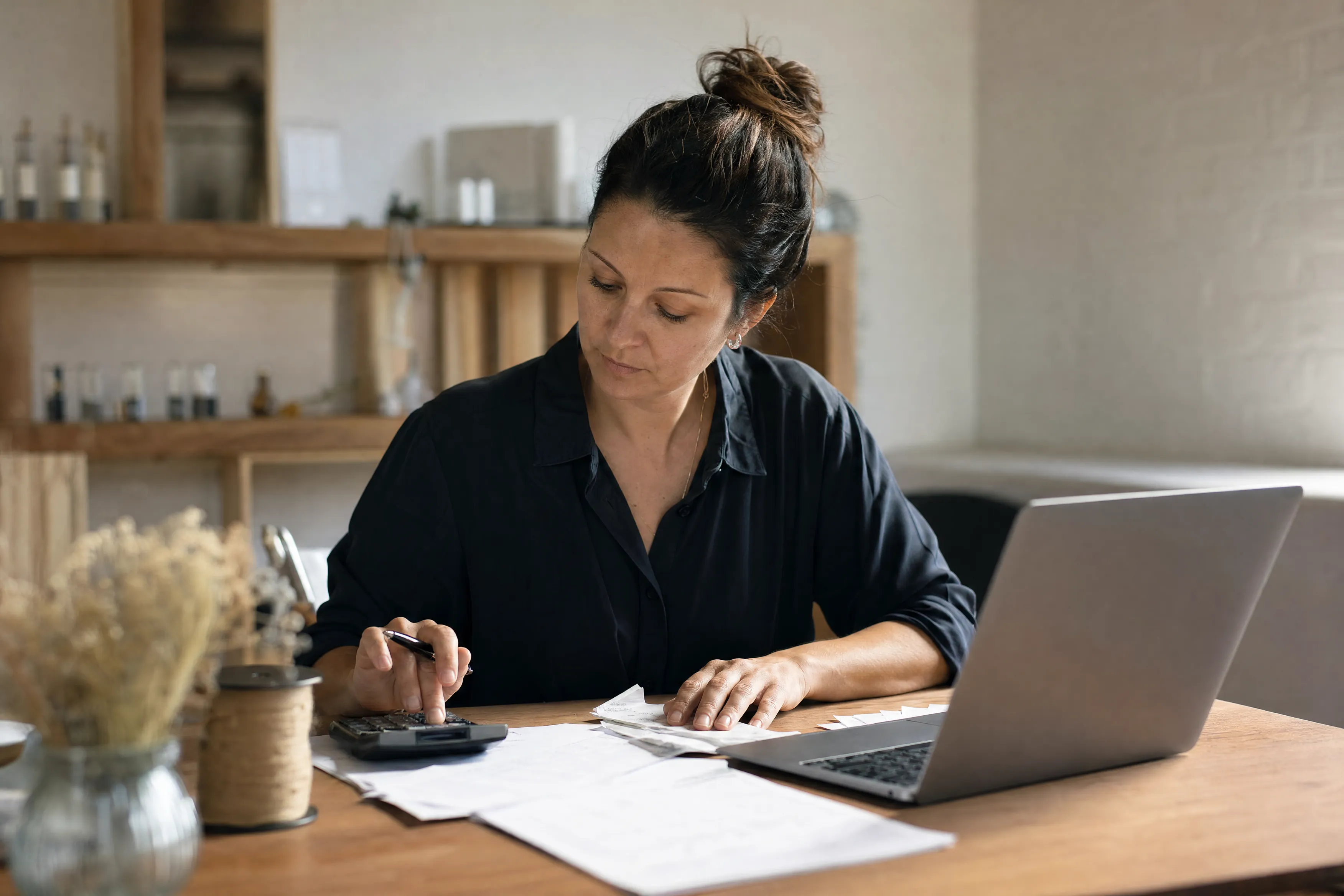 Owner reviewing the books at her desk