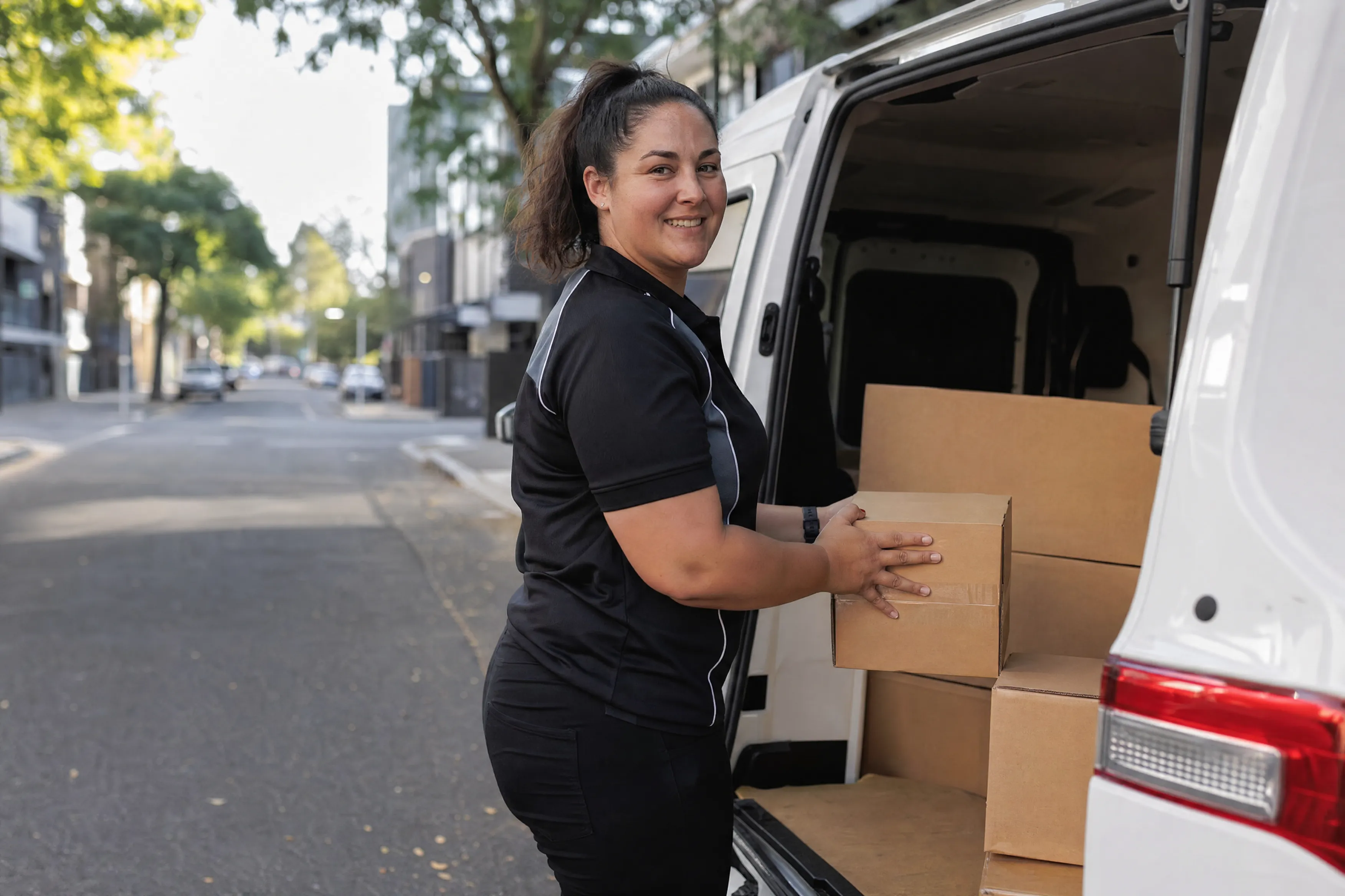 Adelaide courier loading her van