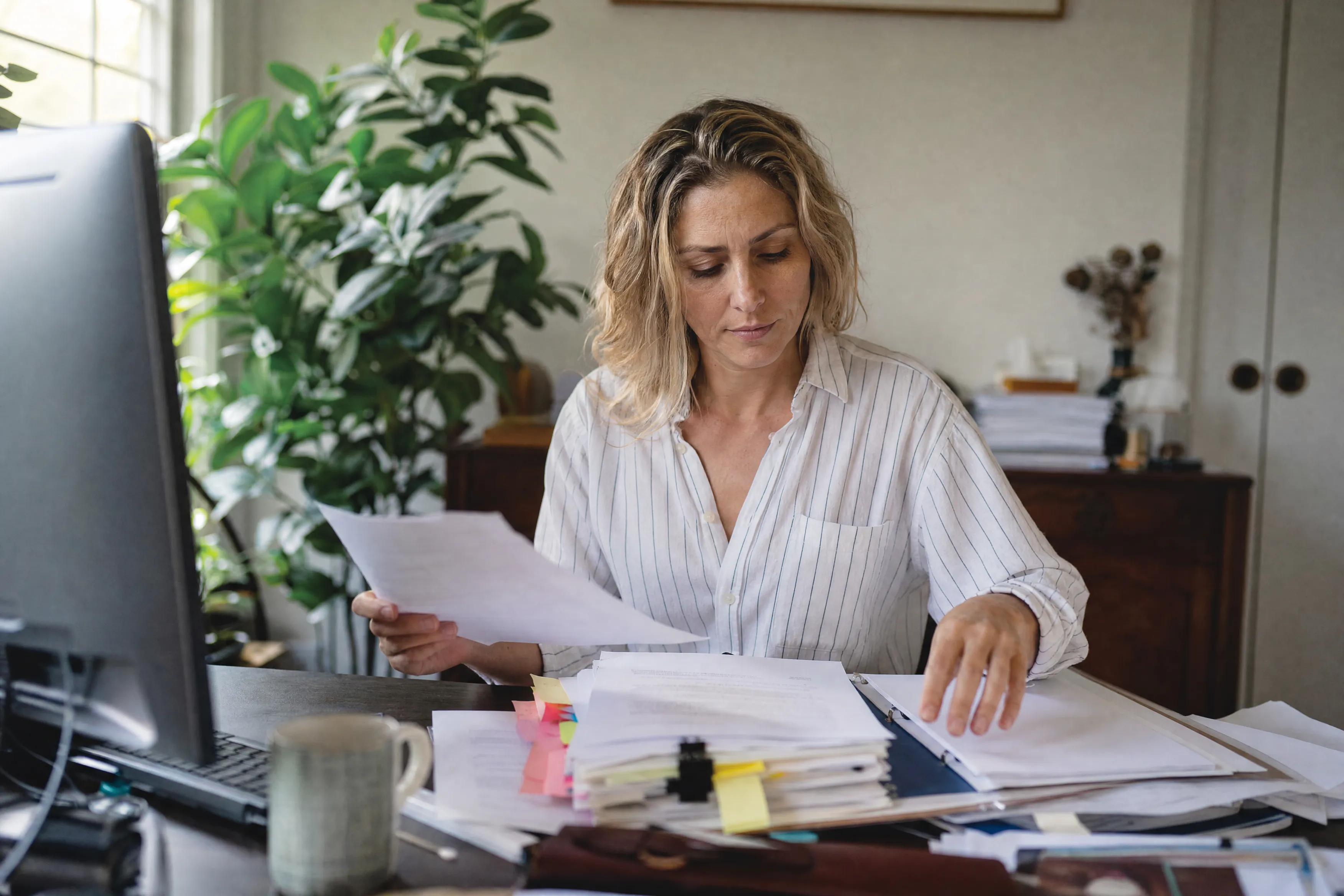 Owner preparing end of financial year paperwork